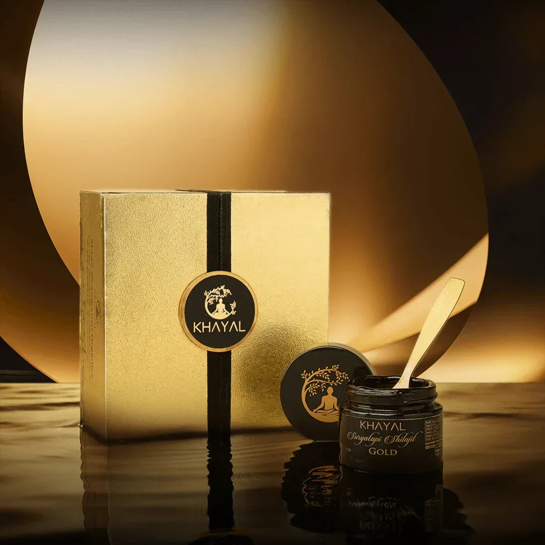 A luxurious gold box with a black vertical stripe and the Khayal logo beside an open jar labeled Khayal Original Suryatapi Shilajit Gold.